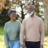 Image of happy african american senior couple in garden